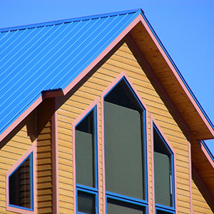 blue metal roof on cabin - click to view metal roofing options